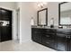 Modern bathroom with dual vanities, granite countertops, and sleek fixtures at 355 Glynnwilde Nw Dr, Marietta, GA 30064