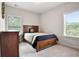 Relaxing bedroom featuring neutral tones, natural light, and soft carpet at 355 Glynnwilde Nw Dr, Marietta, GA 30064