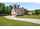 Charming two-story house featuring a spacious driveway and lush green lawns at 355 Glynnwilde Nw Dr, Marietta, GA 30064