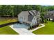 Charming two-story house featuring a stone facade, multi-car garage, and beautifully maintained landscaping at 355 Glynnwilde Nw Dr, Marietta, GA 30064