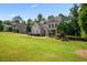 Elegant home with beautiful landscaping, a spacious lawn and an inviting walkway at 355 Glynnwilde Nw Dr, Marietta, GA 30064