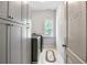 Functional laundry room with modern washer and dryer, built-in cabinets, and convenient storage space at 355 Glynnwilde Nw Dr, Marietta, GA 30064