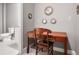 Small office with a desk and chair located next to a bathroom at 355 Glynnwilde Nw Dr, Marietta, GA 30064