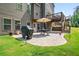 Charming patio with a table, grill, and outdoor seating, perfect for al fresco dining and backyard barbecues at 355 Glynnwilde Nw Dr, Marietta, GA 30064