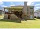Beautiful backyard with a covered deck, manicured lawn, and privacy fence at 3717 Shady Maple Dr, Stonecrest, GA 30038