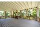 Spacious covered deck with painted beams and wooden railing overlooking the backyard at 3717 Shady Maple Dr, Stonecrest, GA 30038