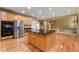 Open-concept kitchen featuring stainless steel appliances, granite countertops, and hardwood floors at 3717 Shady Maple Dr, Stonecrest, GA 30038