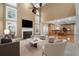 Spacious living room featuring fireplace, high ceilings, and an open view to the kitchen at 3717 Shady Maple Dr, Stonecrest, GA 30038