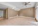 Open concept living room with tan walls, decorative tile floors, and recessed lighting at 3717 Shady Maple Dr, Stonecrest, GA 30038