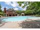 A luxurious swimming pool with plenty of lounge seating and a covered gazebo for community residents to enjoy at 3717 Shady Maple Dr, Stonecrest, GA 30038