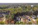 Aerial view of property with a water tower, surrounding trees, and multiple cars in the driveway at 728 Harmony Rd, Temple, GA 30179