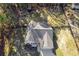 An aerial view shows the roof, driveway, and fenced-in yard with surrounding greenery at 728 Harmony Rd, Temple, GA 30179