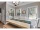 Dining room with large windows, modern lighting, and backyard views at 728 Harmony Rd, Temple, GA 30179
