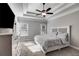 Main bedroom featuring a tray ceiling, ceiling fan, and plush carpeting at 728 Harmony Rd, Temple, GA 30179