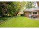 Backyard area with a patio, seating, and a well-maintained lawn at 2808 Peeler Rd, Dunwoody, GA 30360