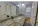 Bathroom with granite countertop, single sink vanity, and a bright, inviting atmosphere at 2808 Peeler Rd, Dunwoody, GA 30360