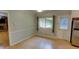 Cozy dining area with a window, neutral paint, and an open doorway into the next room at 2808 Peeler Rd, Dunwoody, GA 30360