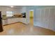 Well-lit kitchen featuring white cabinets, granite countertops, and stainless steel appliances at 2808 Peeler Rd, Dunwoody, GA 30360