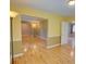 Bright living room featuring hardwood floors, neutral paint, and an open doorway to another room at 2808 Peeler Rd, Dunwoody, GA 30360