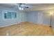 Bright living room with hardwood floors, a ceiling fan, and access to other rooms at 2808 Peeler Rd, Dunwoody, GA 30360