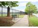 Scenic view with iron fence, bench, and street lamp near the lake at 2808 Peeler Rd, Dunwoody, GA 30360