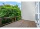 Exterior deck area highlighting a wood railing and lush trees at 3130 Woodwalk Se Trce # 8, Atlanta, GA 30339