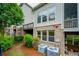 Backyard featuring the exterior of the home and some lush vegetation at 3130 Woodwalk Se Trce # 8, Atlanta, GA 30339