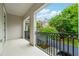 Charming balcony with wrought iron railing offering picturesque neighborhood views at 3130 Woodwalk Se Trce # 8, Atlanta, GA 30339