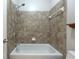 Bathroom featuring a tiled bathtub with shower and white fixtures, offering a clean aesthetic at 3130 Woodwalk Se Trce # 8, Atlanta, GA 30339