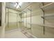 Walk-in closet with multiple tiers of shelving at 3130 Woodwalk Se Trce # 8, Atlanta, GA 30339