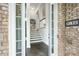 View of the entryway with sleek hardwood floors and an elegant staircase at 3130 Woodwalk Se Trce # 8, Atlanta, GA 30339