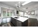 Contemporary kitchen with a central island, modern lighting, and easy access to the dining area at 3130 Woodwalk Se Trce # 8, Atlanta, GA 30339