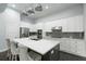 Modern kitchen featuring white cabinets, stainless steel appliances, and a large center island at 3130 Woodwalk Se Trce # 8, Atlanta, GA 30339