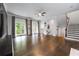 Expansive living room with hardwood floors, French doors, and elegant staircase at 3130 Woodwalk Se Trce # 8, Atlanta, GA 30339