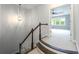 Carpeted staircase with wood trim and view to large, open bedroom area at 3130 Woodwalk Se Trce # 8, Atlanta, GA 30339