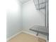 A walk-in closet area with neutral carpeting, white walls, and a wire shelving system at 3130 Woodwalk Se Trce # 8, Atlanta, GA 30339