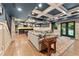 Open basement layout showcasing recreational areas, a wet bar, and comfortable seating at 3750 Maryhill Nw Ln, Kennesaw, GA 30152