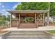 Community cabana with seating, ceiling fans, and stone accents overlooking a lush landscape at 3750 Maryhill Nw Ln, Kennesaw, GA 30152