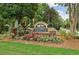 Community entrance sign with colorful landscaping, indicating a welcoming neighborhood, Woodbridge at Hamilton Lake at 3750 Maryhill Nw Ln, Kennesaw, GA 30152