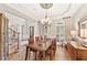 Elegant dining room with hardwood floors, chandelier, and a buffet, perfect for entertaining guests at 3750 Maryhill Nw Ln, Kennesaw, GA 30152