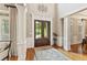 Elegant foyer with hardwood floors, decorative columns, and a grand double-door entrance at 3750 Maryhill Nw Ln, Kennesaw, GA 30152