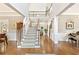 Spacious foyer with hardwood floors, grand staircase, and open layout, creating a welcoming entrance at 3750 Maryhill Nw Ln, Kennesaw, GA 30152