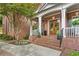 Charming brick front porch with a double-door entrance and decorative plants enhancing its appeal at 3750 Maryhill Nw Ln, Kennesaw, GA 30152