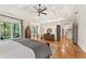 This is the spacious main bedroom suite with tray ceilings, sitting area, and screened porch access at 3750 Maryhill Nw Ln, Kennesaw, GA 30152