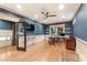 Well-lit office featuring hardwood floors, transom windows, and built-in shelving units at 3750 Maryhill Nw Ln, Kennesaw, GA 30152