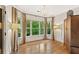 Bright sitting room showcasing hardwood floors, large windows, and elegant lighting at 3750 Maryhill Nw Ln, Kennesaw, GA 30152
