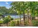 Scenic view of the community tennis courts and cabana surrounded by lush greenery at 3750 Maryhill Nw Ln, Kennesaw, GA 30152