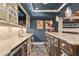 Convenient wet bar area with granite counters, storage, and stainless steel appliances at 3750 Maryhill Nw Ln, Kennesaw, GA 30152