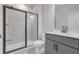 Modern bathroom with a glass-enclosed shower and a gray vanity at 776 Clifftop Xing Xing, Powder Springs, GA 30127