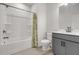 Bathroom with tub-shower combo, a white ceramic toilet, and stylish gray vanity at 776 Clifftop Xing Xing, Powder Springs, GA 30127